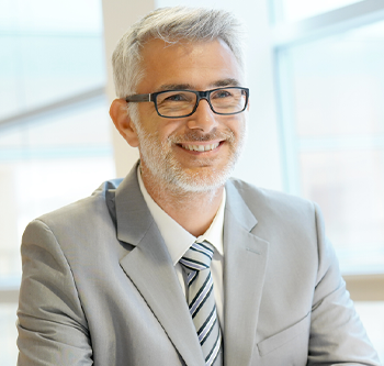 Man in suit speaking with tax advisor