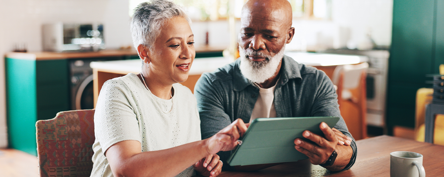 Older couple looking at tablet