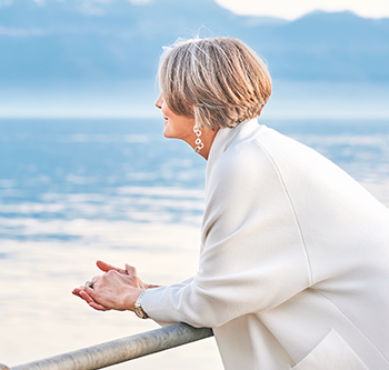 Older woman looking at the beach