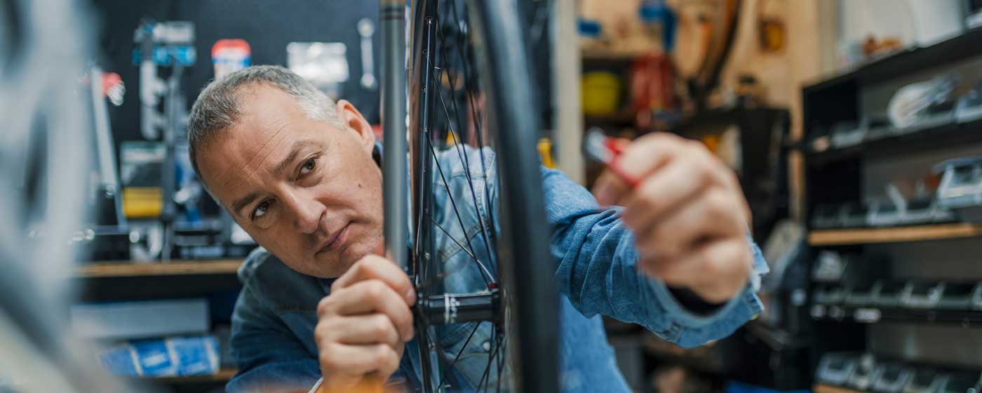 Man working on bicycle tire